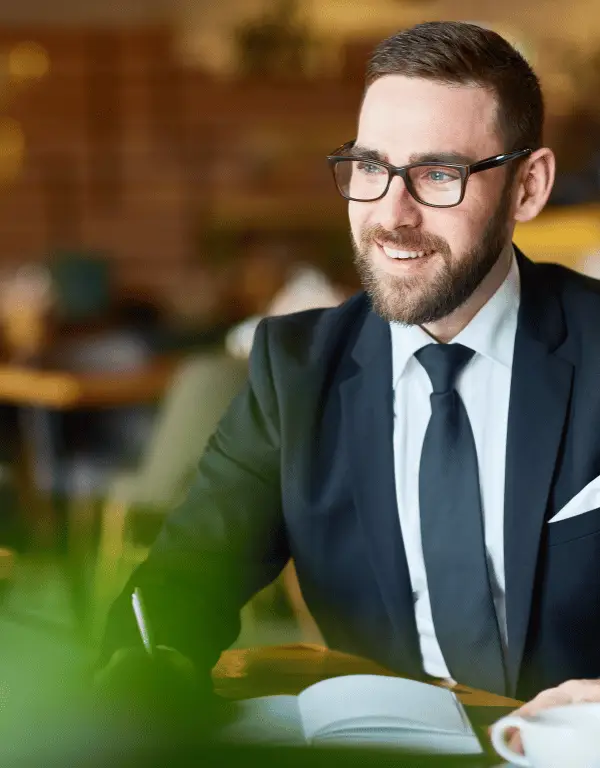 smiling businessman in blue suit